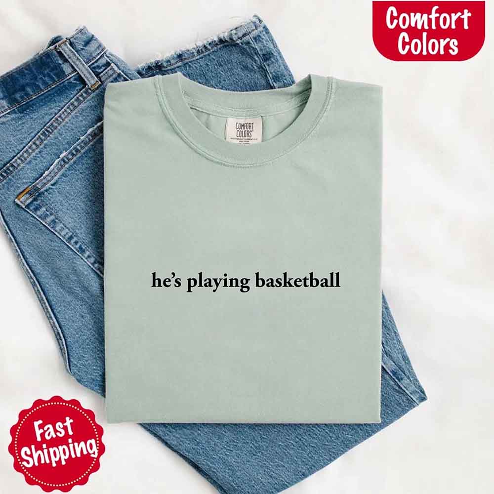 He’s Playing Basketball – Funny Sports Girlfriend Comfort Color Shirt for Women